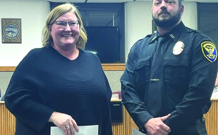 (Courtesy Photo) Gordon City Council President Alyssa DeHart (left) smiles after swearing in the newest officer to the Gordon Police Department, Tyler Mullanix, during the December 18 meeting.