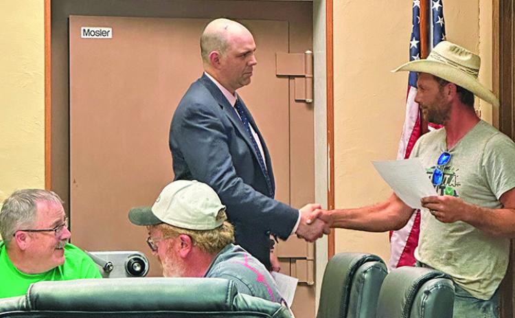 Photo by Heidi Beguin Mayor Keith Kearns watches as Brant Buettner is sworn into office by Hay Springs City Attorney Dan Skavdahl. Read the full story by Heidi Beguin on Page 4!