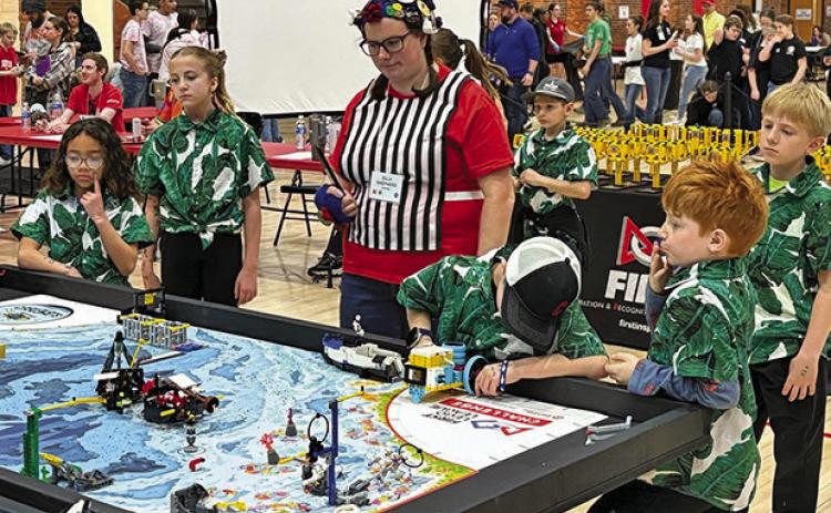 (Photo by Melissa Mracek) The Wild Robots from Rushville compete during the FIRST LEGO League Championships in Lincoln, Neb. on Saturday, March 22.