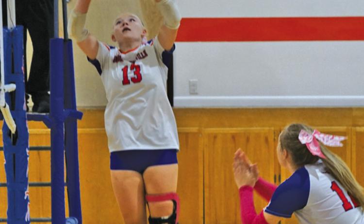 Photo by Michele Heck Sophomore Mikaylee Campbell sets to senior Taleigh Starr during the Western Trails Conference Tournament on Saturday, September 20.