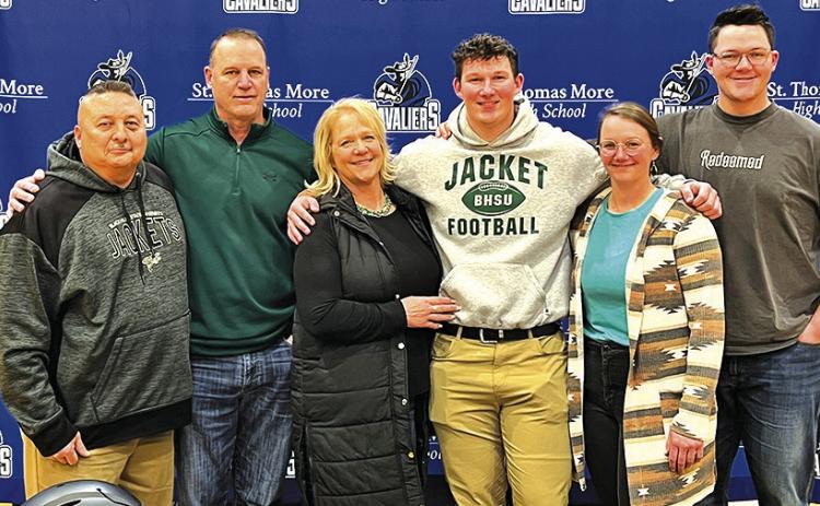 Courtesy Photo St. Thomas More senior and Sheridan County native Marcus Stouffer signed his Letter of Intent to play football at Black Hills State on February 22. Joining Stouffer for the occasion included: (L-R) St. Thomas More Coach Joe Gutierrez, Kelly Stouffer, Barb Stouffer, Marcus Stouffer, Maci Stouffer, and Max Stouffer.