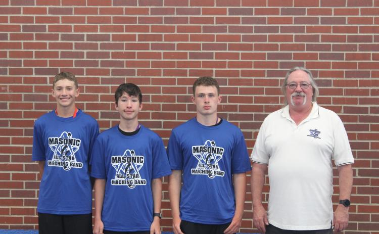 (Courtesy Photo) Robert Moore, Draven Russell, and Caden Sommers participated in the Masonic All-Star Marching Band held in Kearney, Neb. The trio are pictured here with Gordon-Rushville Band Director George Meng.