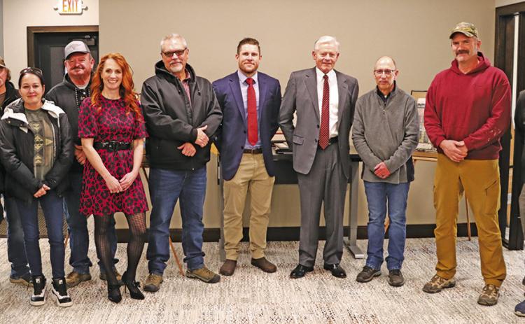 Photo by Scott Bidroski Many of the key players to the successful process to add a new building to The First National Bank of Gordon stopped for a photo during the Open House on Wednesday, December 18. Those pictured include: (L-R) Vinnie Puckett, Randy Puckett, Tess Puckett, Rusty Puckett, Courtney Johnson, John Reed, Cornelius Ray, Will Isham, Glen Spaugh, Chad Kratovil, and Kim Rosane. Not pictured: Nick Burns.