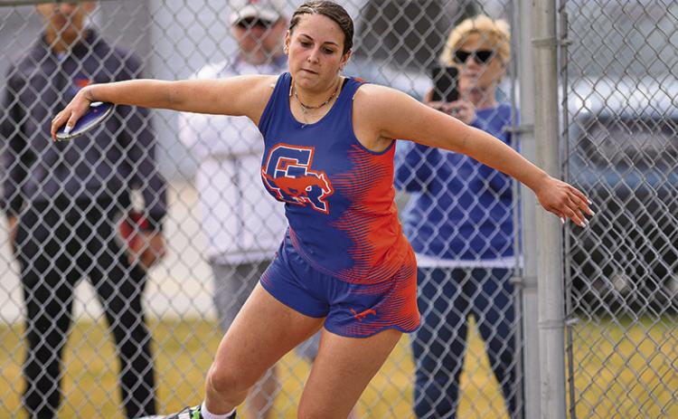 (Photo by Morgan Meisenheimer) Junior McKaley Grover winds up before launching her first place throw in the Discus. Grover was one of three Mustangs who earned a gold at the Binfield Invitational on Friday, March 28.