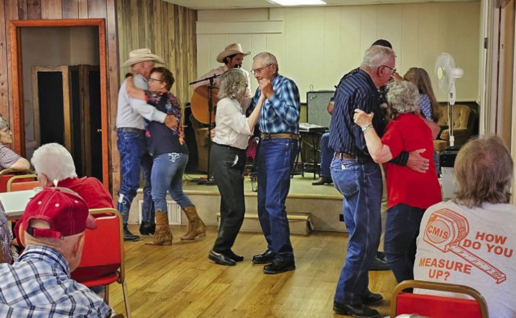Courtesy Photo Several couples take advantage of the country music being played at Rushville’s Senior Center Kitchen Concert on June 29.