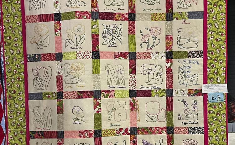 (Courtesy Photo) The finished quilt is proudly displayed with all 25 hand embroidered squares that a group of volunteers in Sheridan County brought back to life in this beautiful quilt.