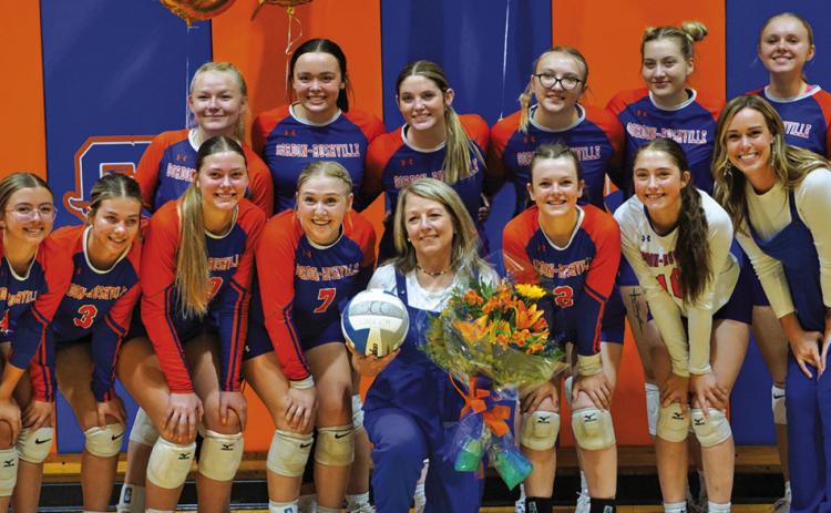 Photo by Michele Heck The Gordon-Rushville Volleyball team presented Coach Kim Campbell flowers and a signed volleyball to celebrate her 500th win as a volleyball coach. Coach Campbell became the 35th coach in Nebraska High School Volleyball history to win 500 matches with her win over Ainsworth on Thursday, September 17. Read the full story on Page 7!
