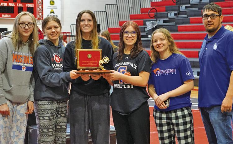 (Photo by Michele Heck) The Gordon-Rushville Wrestling Girls Wrestling team took home the first place trophy from the Ainsworth Tournament on Friday, January 31. Those pictured include: (L-R) Stormy Tesch, Jenifer Banister, Kirsten Heck, Lainey Fillmore, Madyson DeHart-Harris, and Coach Jose Campos.