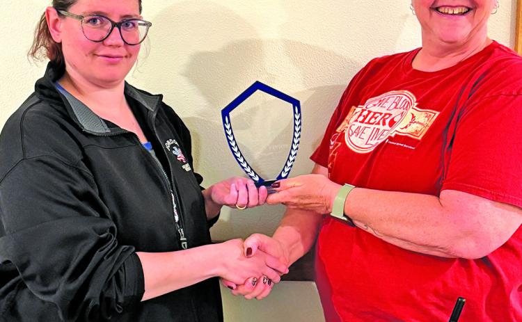 Courtesy Photo Cynthia Vinton (left) receives the 2024 Responder of the Year award from Rescue Squad Chief Marchelle Paul at a recent meeting. Vinton joined the squad in the fall of 2023. See the full story on Page 3!
