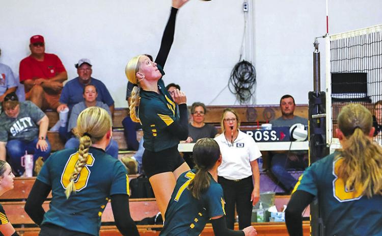 Photo by Megan Andersen Hooker County Tribune Junior Emily Forney fires a shot during an earlier match in 2026. Forney and the Hawks are on a roll following two season opening losses as the group won all five matches they played this past week.