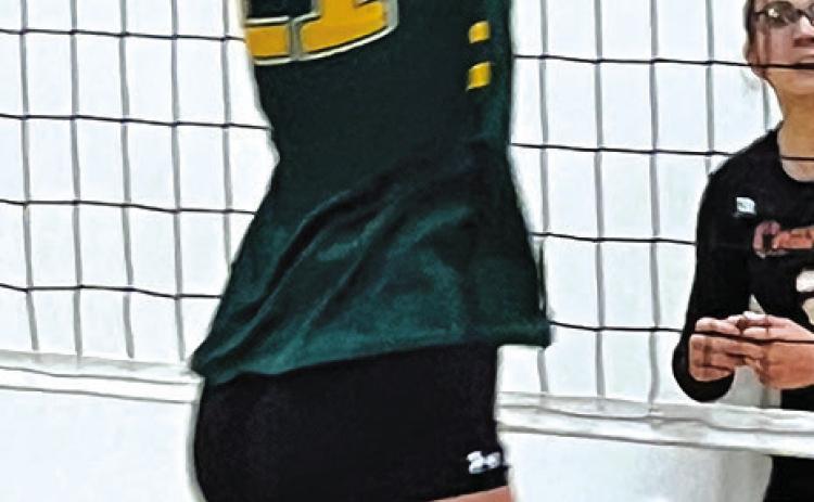 Courtesy Photo Freshman Devyn Young goes up for the block against C-K.