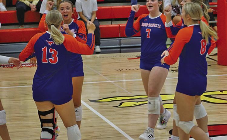 Photo by Michele Heck The Mustangs celebrate an ace during the match against Chadron on Thursday, September 4.
