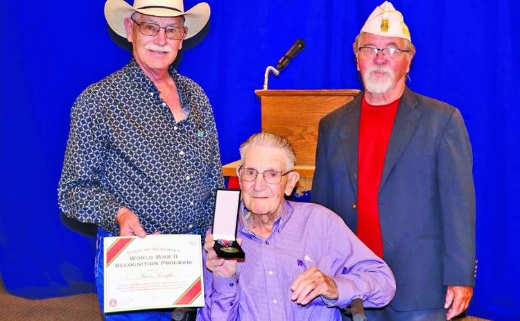 (Photo by Scott Bidroski) During a ceremony at the Rushville American Legion Post #164, World War II Veteran Amos ‘Bud’ Knight received a Medal of Recognition from the State of Nebraska. This is the 155th medal presented across the state from the program. Knight lives in Rushville. Pictured is Jerry Knight, son of Bud Knight, Amos ‘Bud’ Knight, and Area D Commander Cliff Rininger.