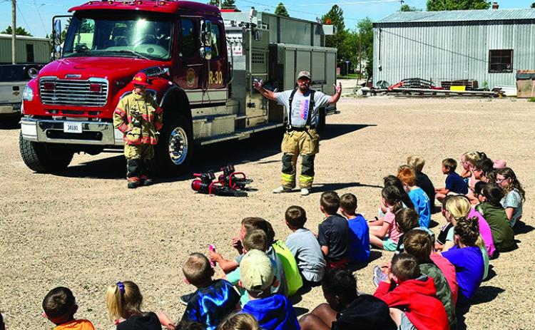 Photo by Scott Bidroski The students at the STEAM program in Rushville getting a safety demonstration from the Rushville Fire Department.