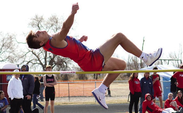 Sophomore Daniel Martins elevates over the bar in the High Jump in Bayard. Photo by Scott Bidroski