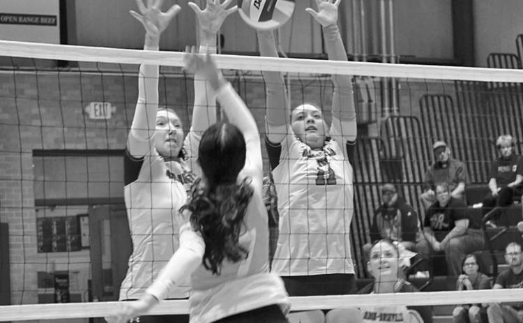 Photo by Michele Heck Junior Stormy Tesch and senior Taleigh Starr go up for the block against Valentine on Thursday, October 9. The Badgers would get the win though, 3-0.