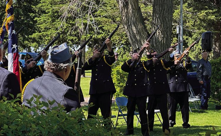 Photo by Heidi Beguin The Color Guard from Rushville Post #161 fires off a 21gun salute for the Memorial Day services at the Rushville Cemetery.