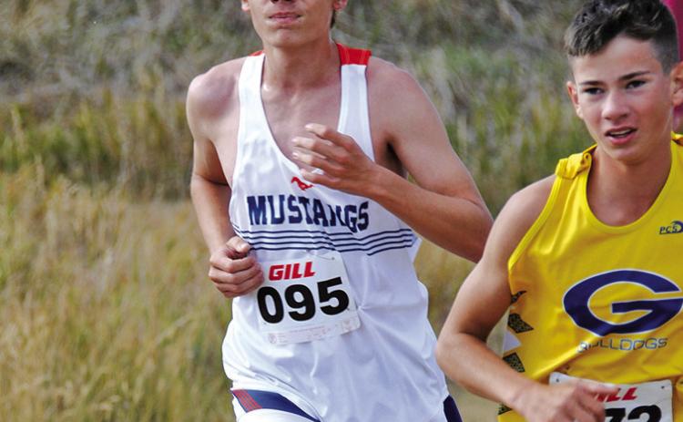 Photo by Chris Heiser Sophomore Draegon Leonard digs deep in the 5K race at Chadron State College on Friday, September 13.