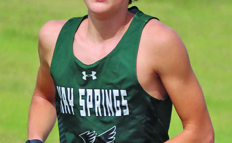 Photo by Scott Bidroski Hawks junior Grant Wellnitz runs through Laing Park in Alliance on Friday, September 18.