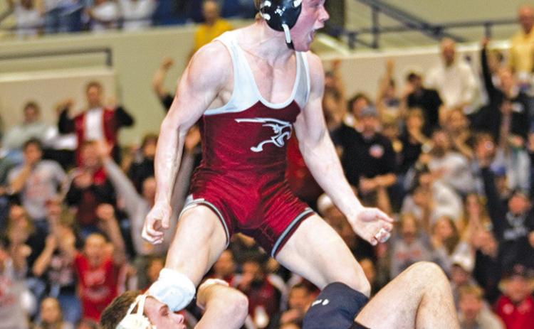 Courtesy Photo Then a senior at Chadron State College, Rushville native Brett Hunter had reason to celebrate when this photo was taken. He had just won his second NCAA Division II National Wrestling Tournament championship by edging Marty Usman of Nebraska-Kearney 3-2 for the 174-pound title. Hunter finished his college career with a 133-32 record.