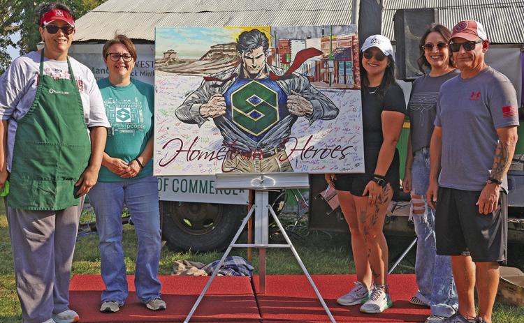 (Courtesy Photo) Members of the Security First Bank staff accepted this one of a kind painting done by local artist, Autumn Mangione. Those included in the photo are: (L-R) Sherry Erman, Amanda Haller, Morgan Weyers, Melissa Jancik, and Dave Galyen.