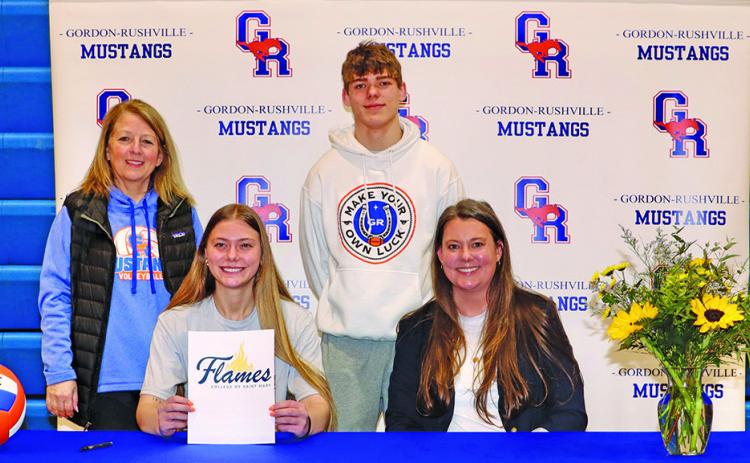 Photo by Scott Bidroski Gordon-Rushville senior Emma Martins signed her letter of intent to play collegiate volleyball at the College of St. Mary’s on Tuesday, March 11. Martins is joined by Gordon-Rushville Volleyball Coach Kim Campbell, her brother Daniel Martins, and mother Ashley Martins in the photo.