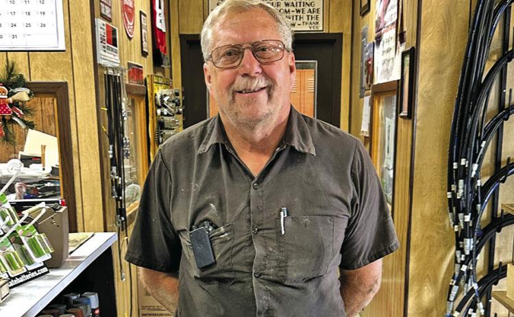 (Photo by Scott Bidroski) Rex Retzlaff was chosen as the 2025 Sheridan County Fair &amp; Rodeo Good Neighbor. Retzlaff, pictured here at his job at Frontier Service and Supply in Rushville, was recognized for his many years of dedication to his community.
