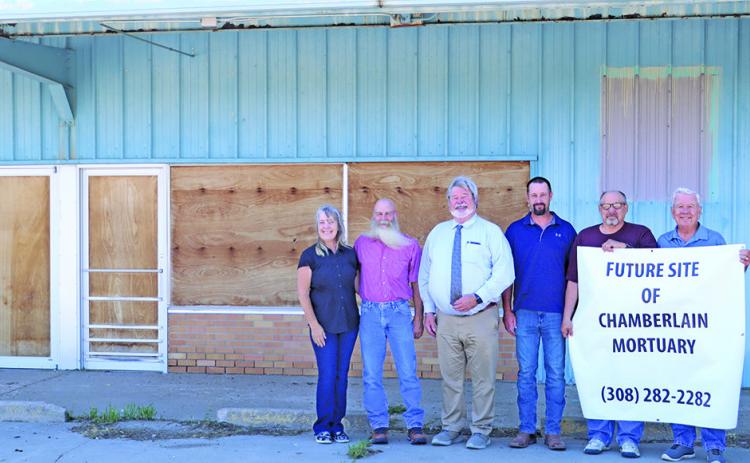 (Photo by Scott Bidroski) A property that has long been empty on the north side of Gordon has new owners. Chamberlain Mortuary purchased the property from Joe and Rosana Kirk and has plans to renovate the building to suit their needs. Pictured in the photo include: (L-R) Rosana Kirk, Joe Kirk, Jeff Chamberlain, Thomas Chamberlain, Harlen Wheeler, and Larry Turnbull.