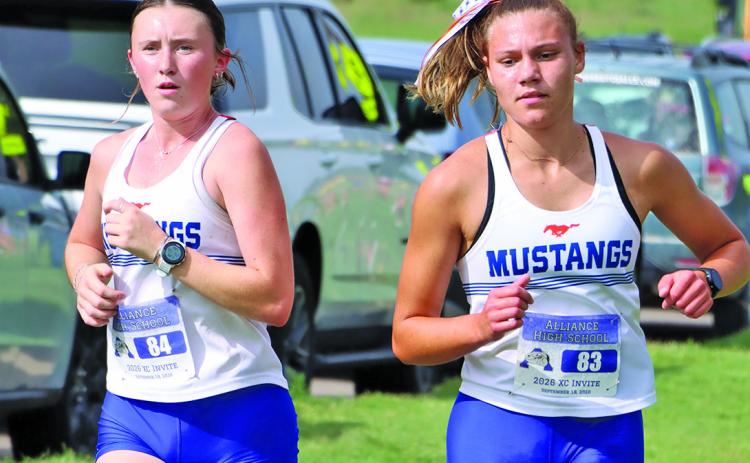 Photo by Scott Bidroski Junior Kynsleigh Krebs (left) and sophomore Brittney Dehning (right) have been tearing up Panhandle courses and pacing their team to four team championships this season. This past week, Krebs placed first and second in her two races with Dehning placing second and third respectively.