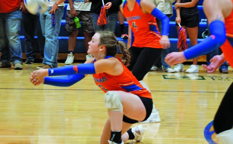 Photo by Michele Heck Senior Braylynne McKimmey gets down for the dig against Chadron. McKimmey finished the match with 16 digs.