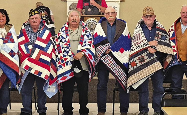 Photo by Kathy Dye On Saturday, October 12, six Veterans were honored with a Quilt of Valor for their service in the military branches. Those honored on the day were: (L-R) Lynette Kills Black, Jim Landreth, Fred Cano, David Roth, Jack Bermingham, and Jerry Janssen.