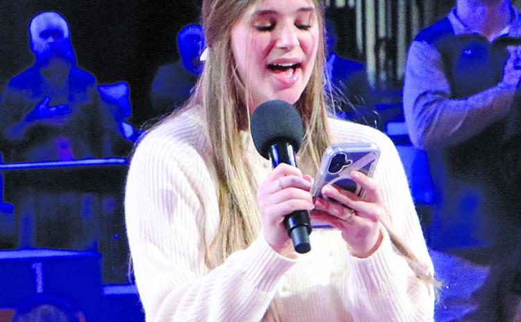 (Photo by Blake Peterson) GRHS junior Amara Funk was chosen to sing the National Anthem Saturday at the NSAA State Wrestling Tournament.