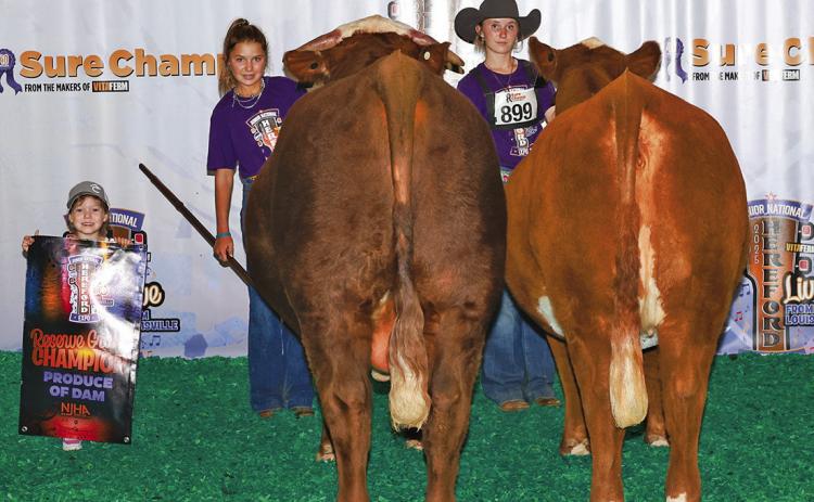 Courtesy Photo Reserve grand champion produce-of-dam group, Kynsleigh Krebs (right) with sister Kashlyn (left).