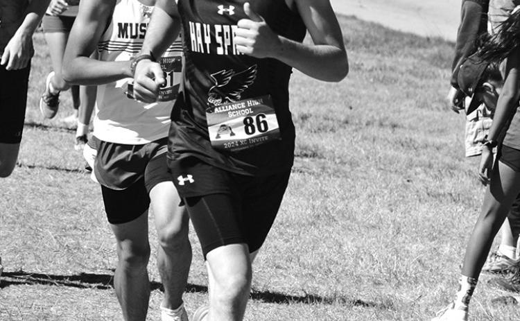 Photo by Chris Heiser Junior Mason Albrecht stays ahead of a few competitors during the Alliance Cross Country Invite on September 21.